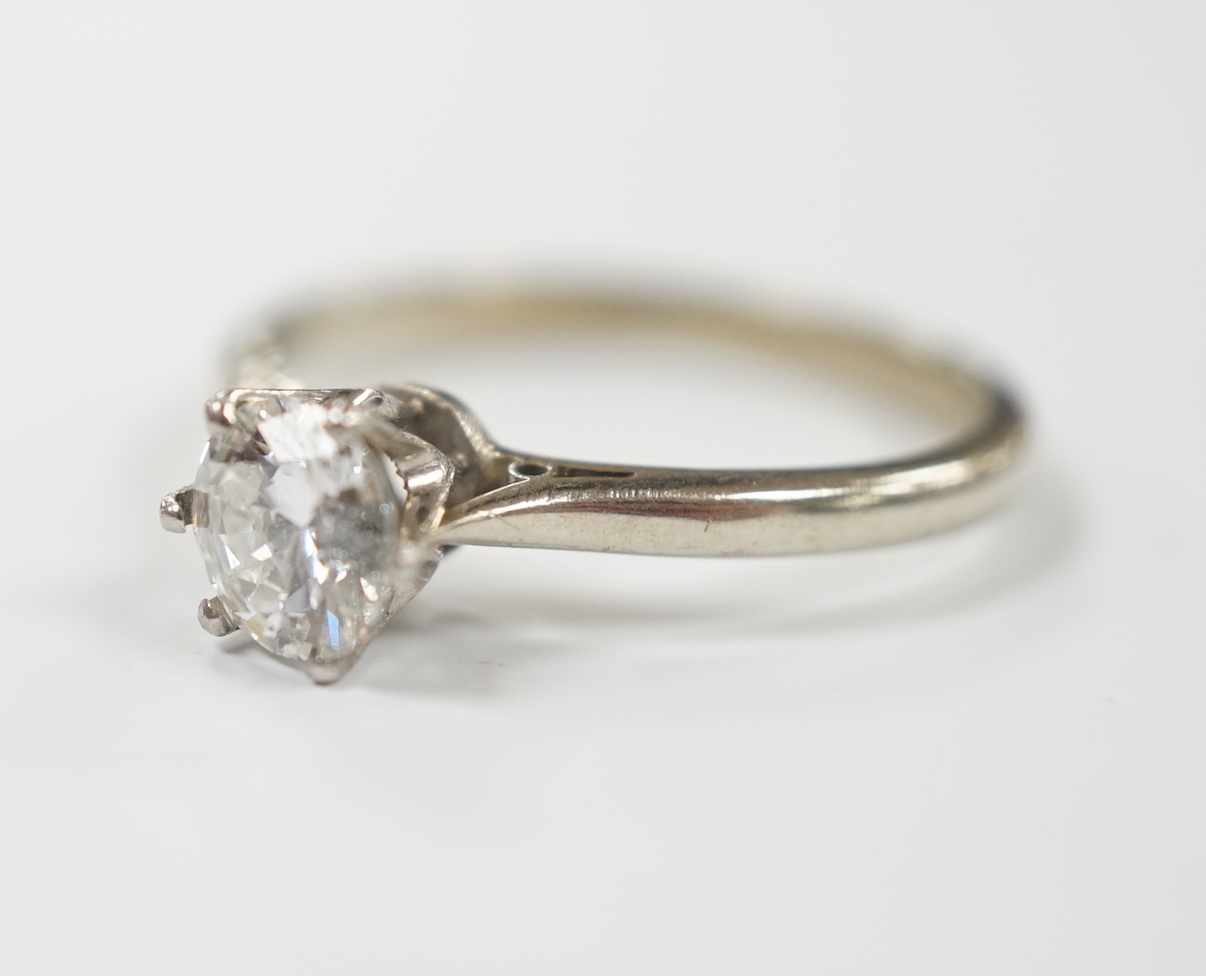 An 18ct and solitaire diamond set ring, size M, gross weight 1.9 grams, the stone diameter 5.5mm.